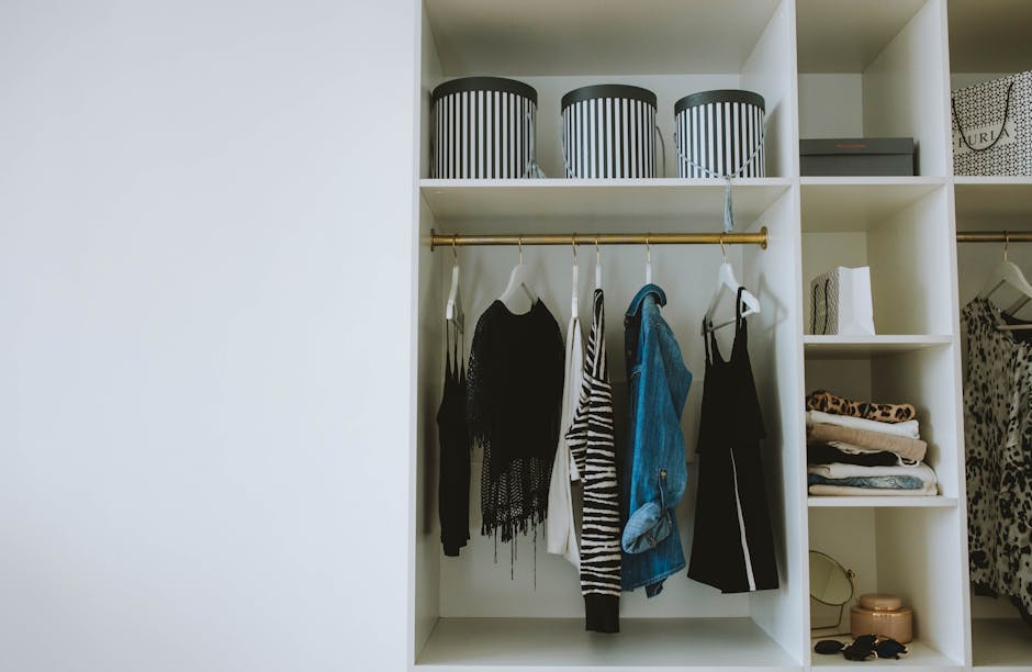 colorful wardrobe closet with organized neutral clothing pieces