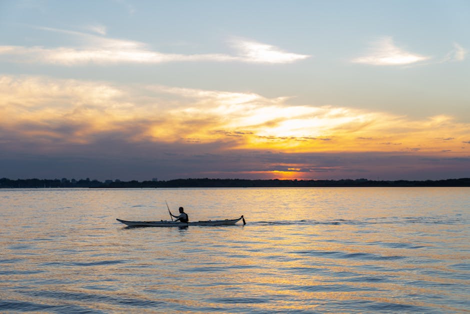 kayak on calm lagoon at golden hour