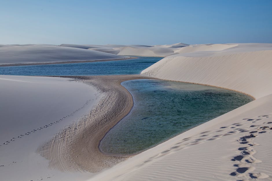 sand dunes with freshwater lagoon at sunset