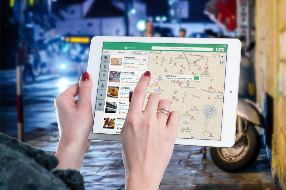 A screen displaying an AI-powered travel planning interface with various itinerary options, hotel bookings, and flight details, demonstrating smart logistics.