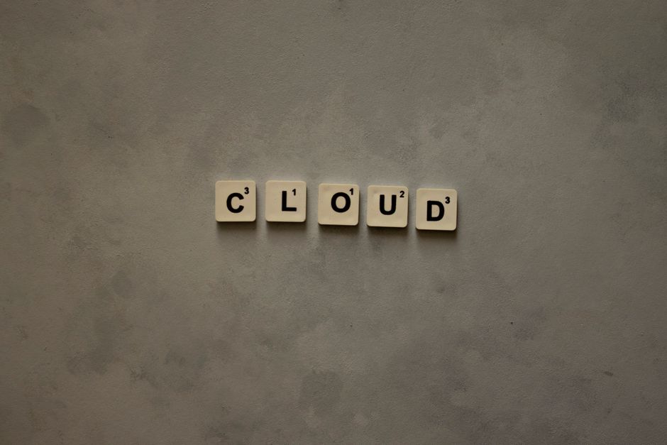 Illustrative icons for iCloud, Google Drive (representing Google Photos storage), and OneDrive arranged around a central cloud graphic.