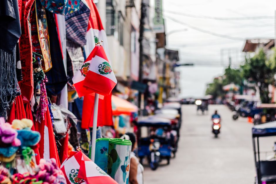 Vibrant street market in Oaxaca, Mexico, filled with fresh produce, spices, and local vendors.