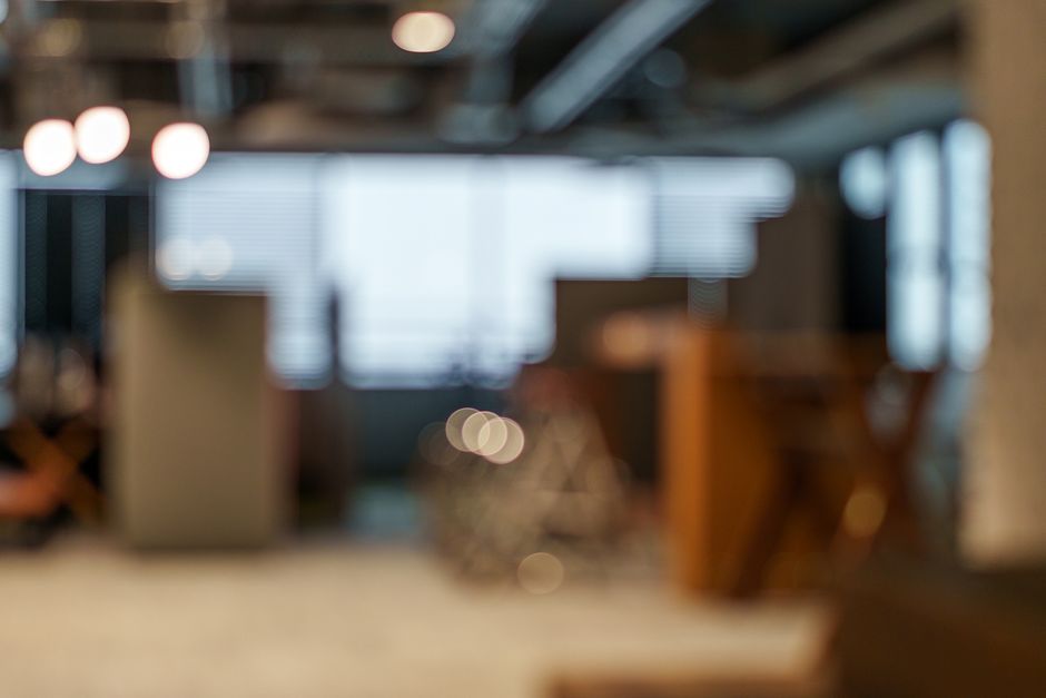 A bright, modern coworking space with people working at desks, emphasizing reliable internet for remote workers.