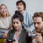 Gamers of various ages and backgrounds enjoying different free-to-play titles across multiple devices, emphasizing accessibility and fun without financial pressure.