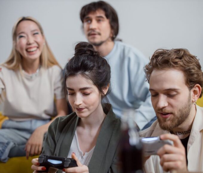 Gamers of various ages and backgrounds enjoying different free-to-play titles across multiple devices, emphasizing accessibility and fun without financial pressure.
