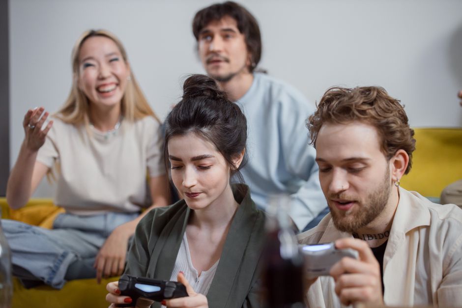 Gamers of various ages and backgrounds enjoying different free-to-play titles across multiple devices, emphasizing accessibility and fun without financial pressure.