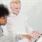 People from various backgrounds engaging with AI-powered smart home devices and collaborative work tools, depicting the practical future of AI.