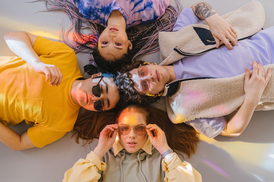 A group of people with various face shapes enjoying sunny weather while wearing different styles of sunglasses.