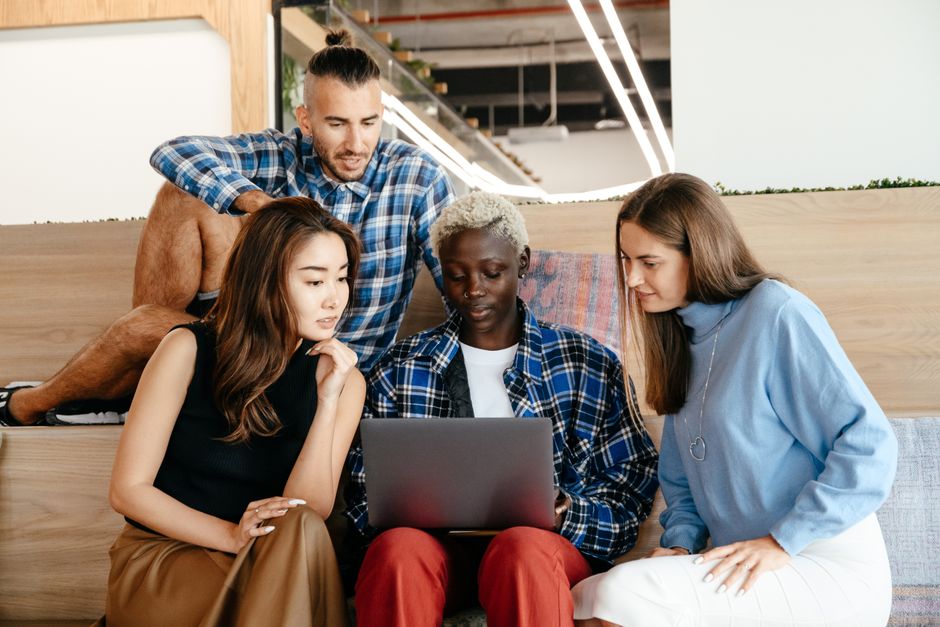A collage of diverse remote workers from different continents, each using a laptop or tablet to conduct online research, highlighting the global impact of search changes.