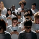 A diverse group of individuals – a student with a laptop, a freelancer on a tablet, and a family looking at a phone – all connected by digital lines, symbolizing cloud access from different devices and locations.