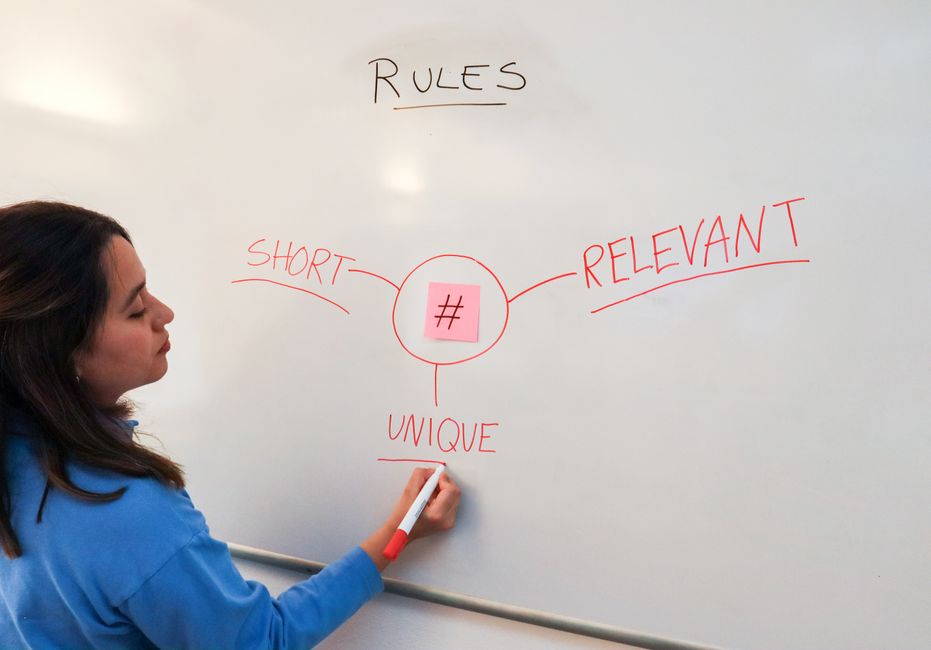 A whiteboard with 'Family Digital Rules' written, showing a parent and child discussing guidelines for screen time and internet use.