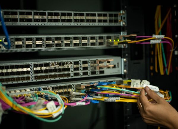 Bright fiber optic cables running through a modern city, symbolizing high-speed internet infrastructure.