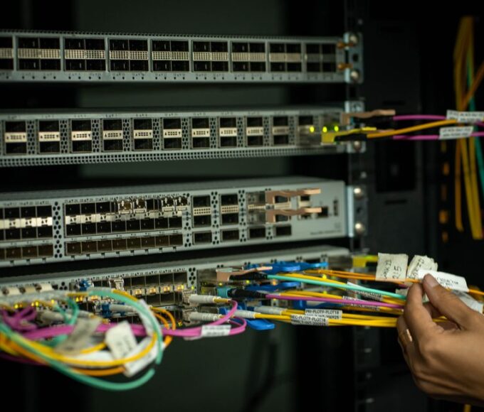 Bright fiber optic cables running through a modern city, symbolizing high-speed internet infrastructure.