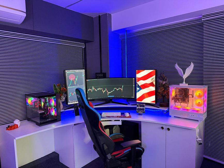 A powerful gaming PC setup with multiple monitors displaying a detailed game, a mechanical keyboard, and gaming mouse, representing high-performance PC gaming.