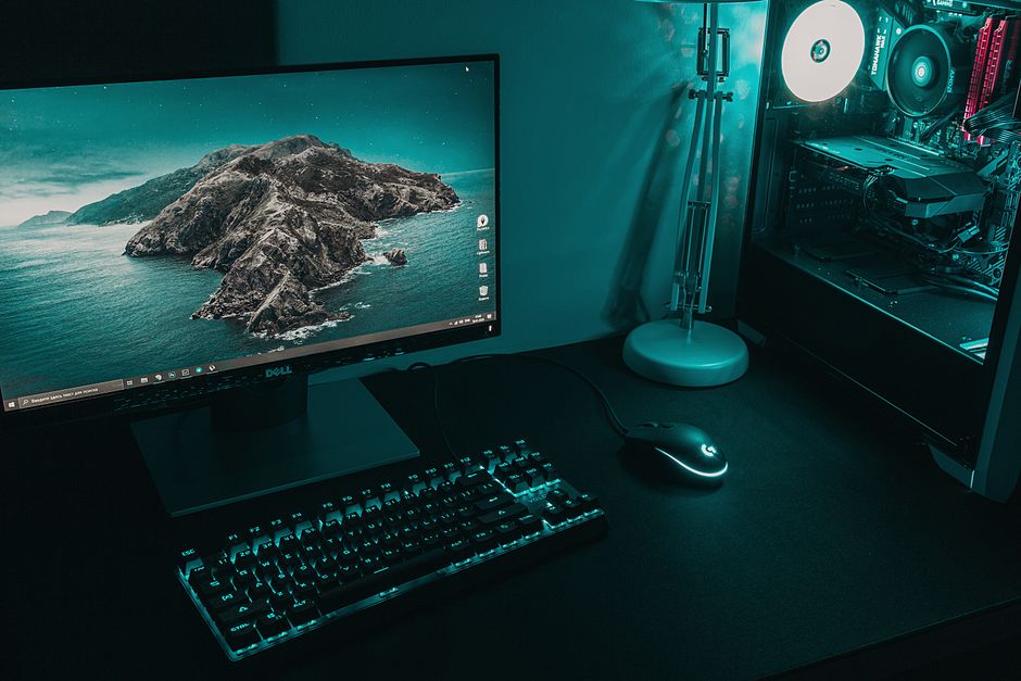 Various cleaning tools for electronics laid out, including compressed air, microfiber cloth, cotton swabs, and a keycap puller, ready to keep gaming gear clean.