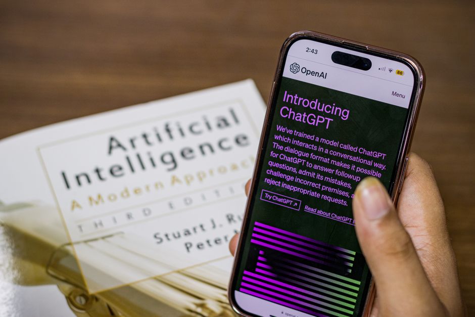 Close-up of a hand holding a tablet displaying a summarized research paper with AI-generated highlights, illustrating the utility of AI research assistants for academic work.
