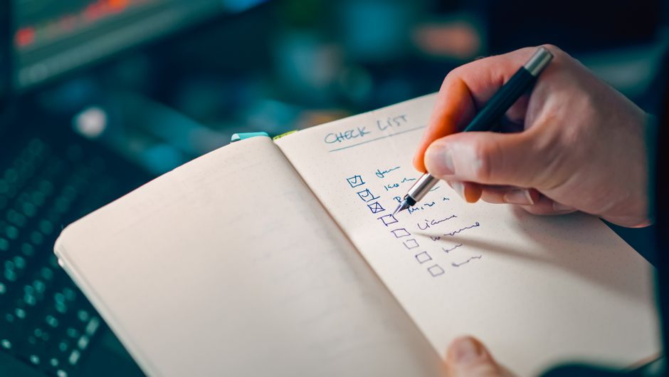 A split image showing a 'Manual' column with a person writing and a 'Automate' column with smart home devices, illustrating the smarter checklist concept.