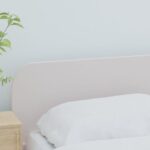 A bright, minimalist bedroom with neutral tones, clean lines, and a large window, suggesting calm and spaciousness.
