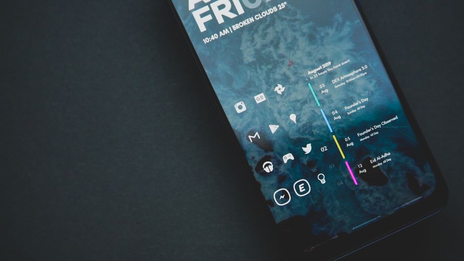 A smartphone displaying a very clean, minimalist home screen with only essential app icons visible, no notifications.