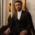 A person wearing a stylish, form-fitting jacket that subtly integrates smart fabric technology, illustrating how fashion tech can look completely normal.