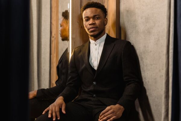 A person wearing a stylish, form-fitting jacket that subtly integrates smart fabric technology, illustrating how fashion tech can look completely normal.
