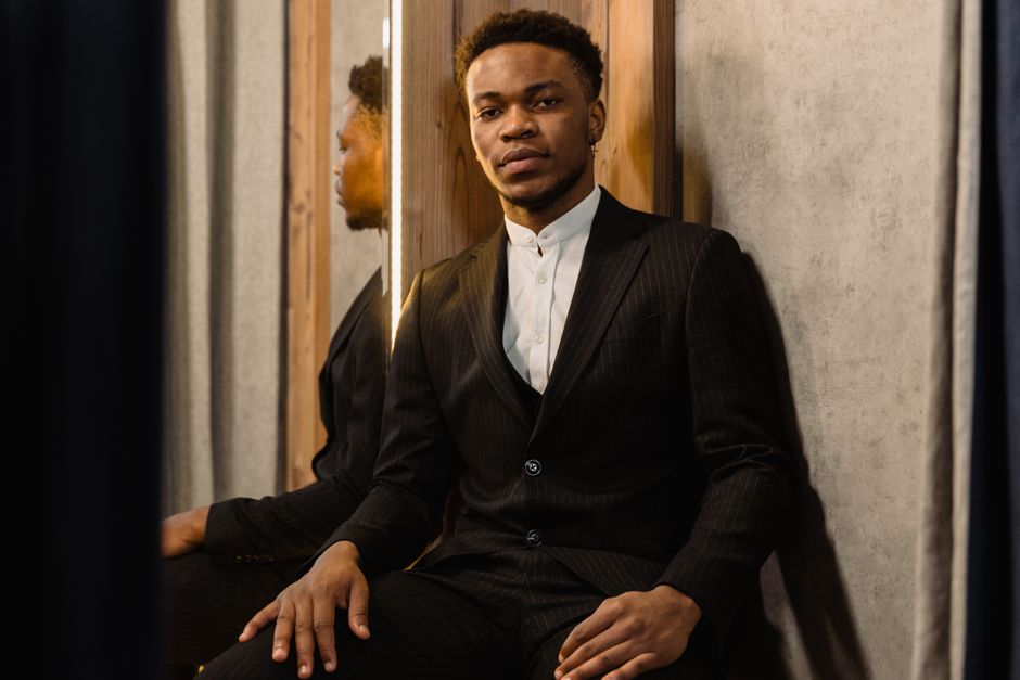 A person wearing a stylish, form-fitting jacket that subtly integrates smart fabric technology, illustrating how fashion tech can look completely normal.