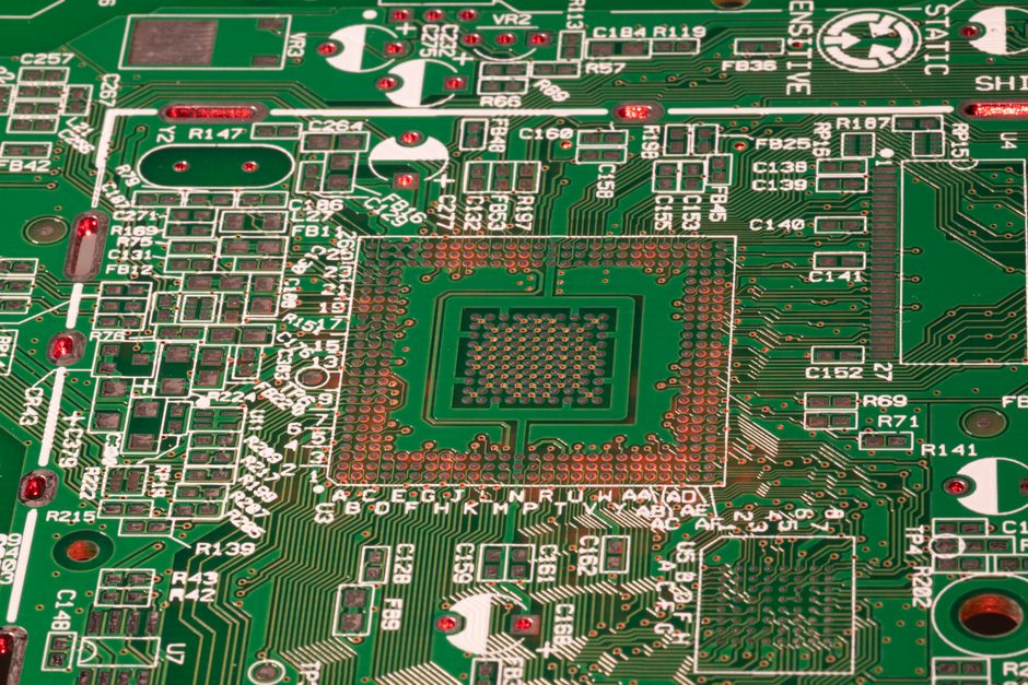 A close-up technical shot of a computer motherboard, clearly highlighting a dedicated Neural Processing Unit (NPU) chip with intricate circuitry.