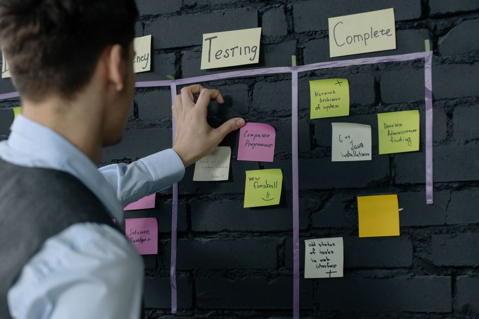 A person sitting at a desk, reviewing a dashboard with AI-generated summaries and task automations, illustrating the integration of AI agents.