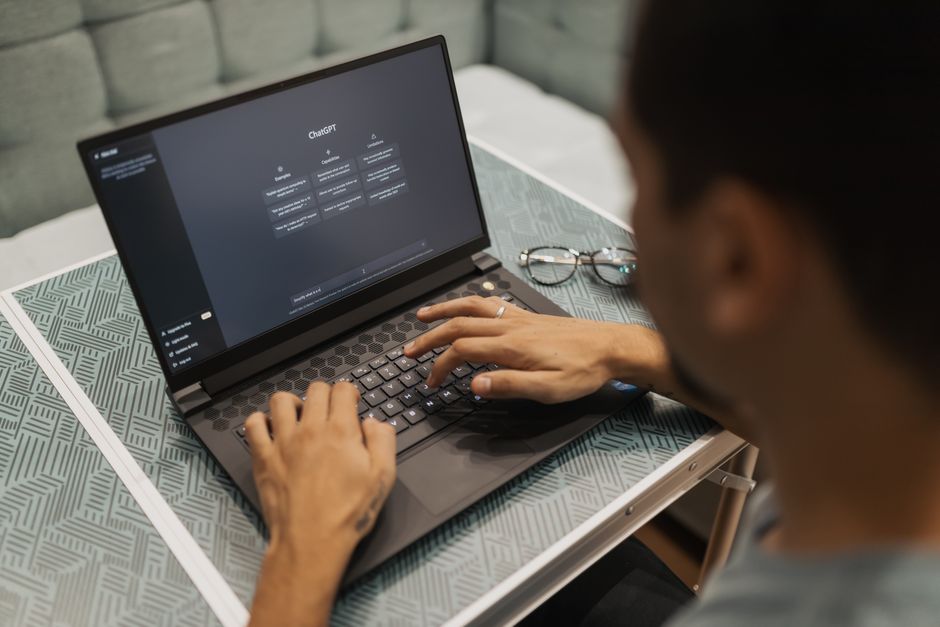 An energetic individual with multiple glowing digital screens around them, each showing different AI applications automating business tasks for a solo entrepreneur.