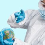 A person's hands hover over a holographic globe, with digital data streams emanating, symbolizing global digital protection.