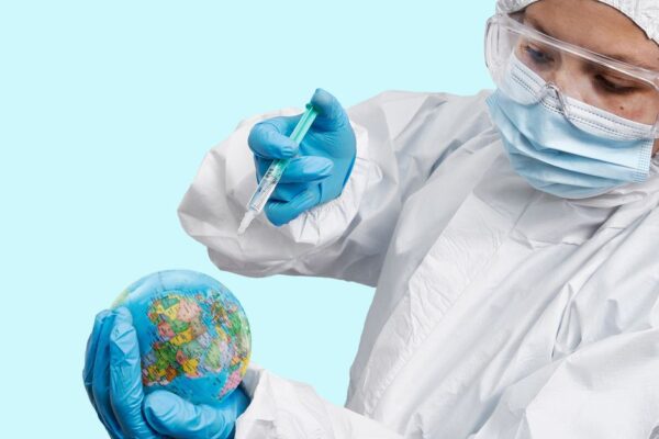 A person's hands hover over a holographic globe, with digital data streams emanating, symbolizing global digital protection.