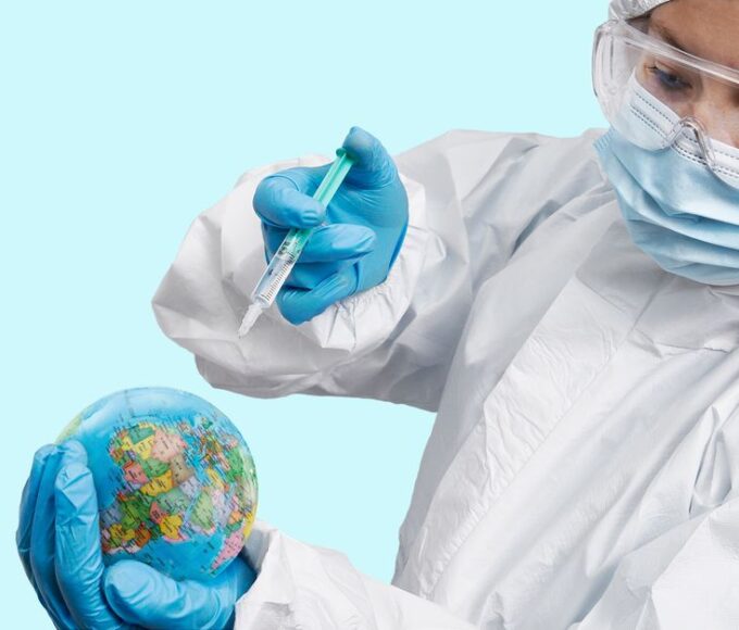 A person's hands hover over a holographic globe, with digital data streams emanating, symbolizing global digital protection.
