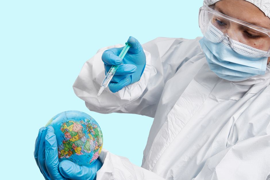 A person's hands hover over a holographic globe, with digital data streams emanating, symbolizing global digital protection.