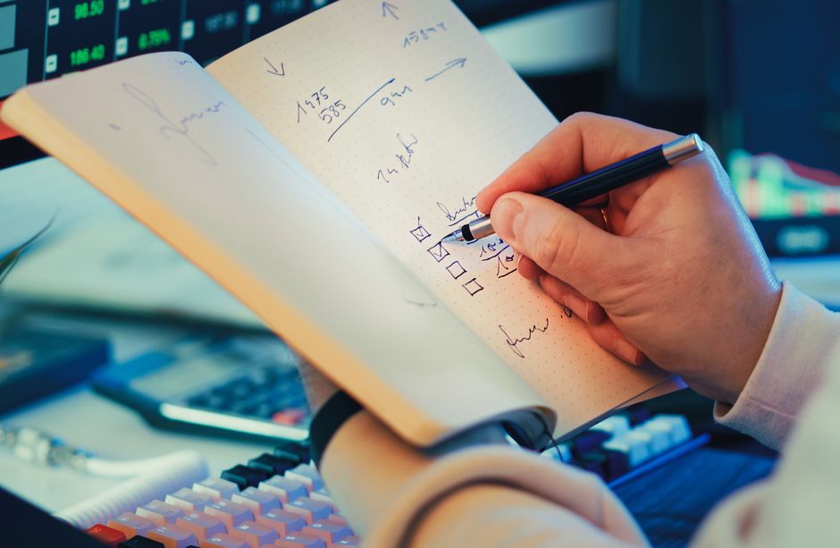 A person thoughtfully reviewing AI-generated meeting notes on a tablet, highlighting a section, with a cup of coffee nearby, emphasizing the human oversight needed for AI outputs.