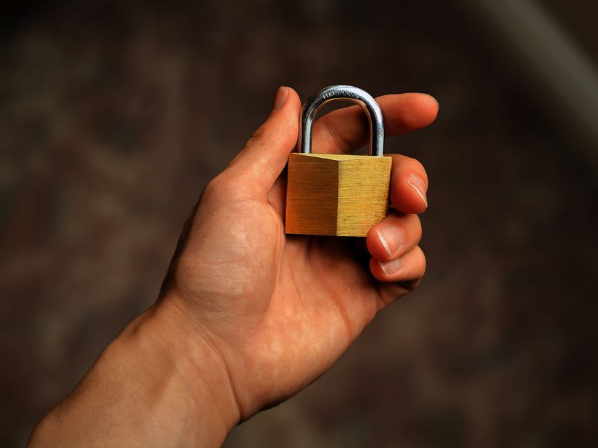 A stylized graphic showing a padlock icon hovering over various gaming platform logos like Steam, Xbox, and PlayStation, representing account security.