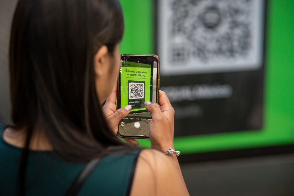 A visually striking graphic showing a QR code with a 'scam alert' or 'fraud' warning overlayed.