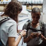 A traveler in a bustling European square looking at their phone, representing seamless connectivity with an eSIM.