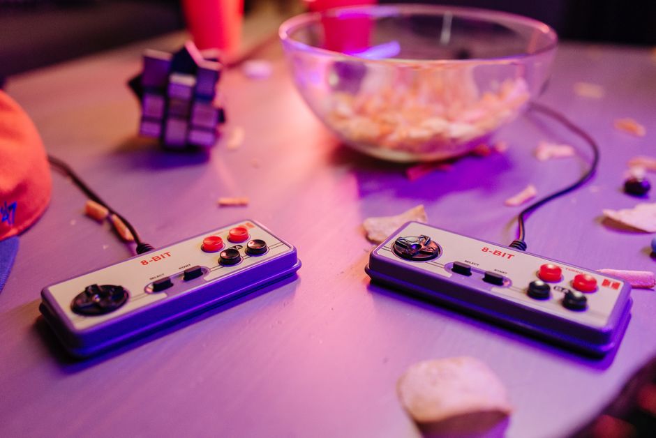 An overhead shot of several modern gaming controllers from various brands laid out on a clean surface, emphasizing options.