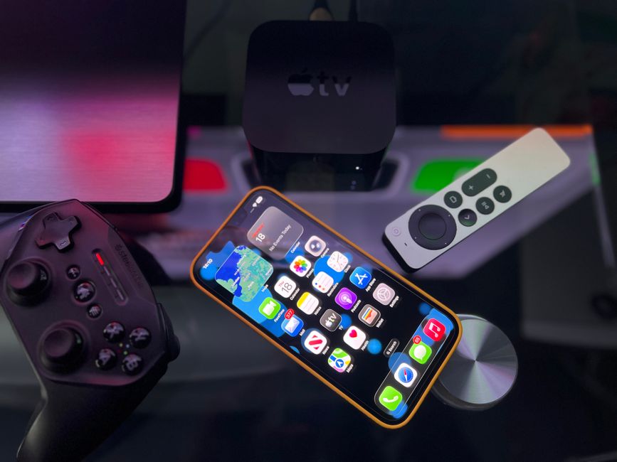 A collection of gaming devices including a smartphone, a console controller, and a portable handheld, illustrating diverse options for one-hour gaming.